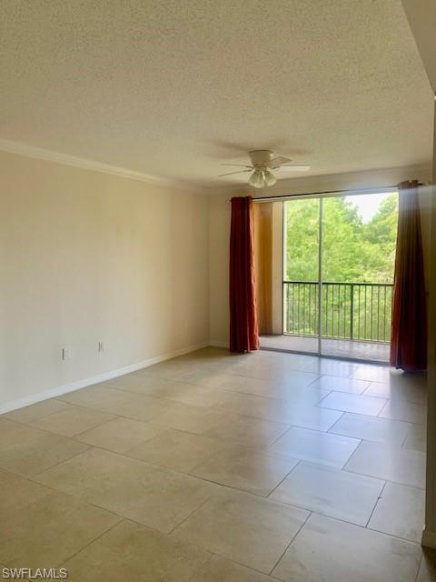 1180 Reserve Way, Unit 206 Naples, FL 34105 - Photo 5 of 22 a view of an empty room with a balcony
