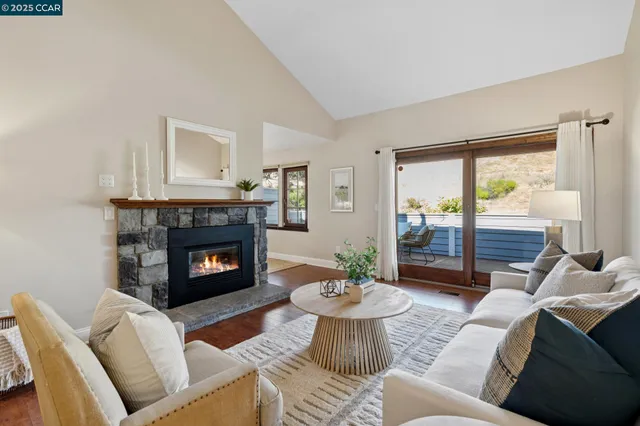 a view of a patio with table and chairs with wooden floor and fence