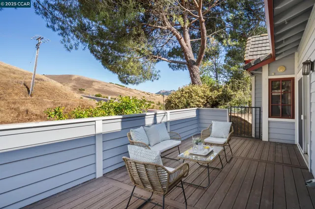 a bedroom with a large bed and a couch