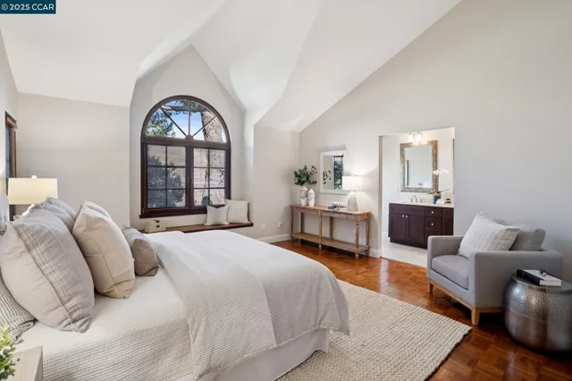 a bathroom with double sink and two mirror