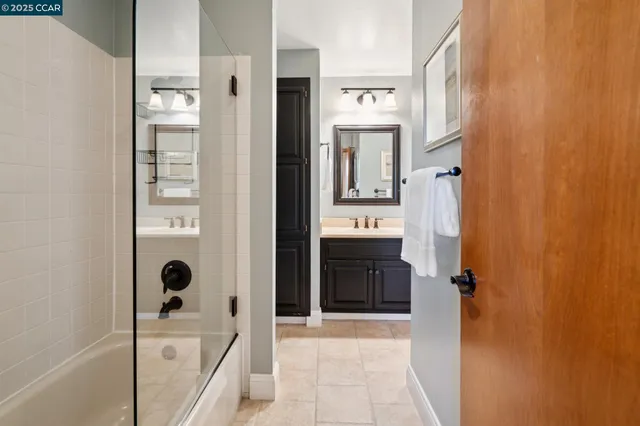 a living room with furniture and painting on the wall