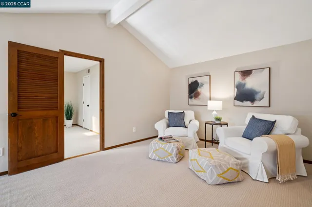 a bathroom with a sink vanity mirror and toilet