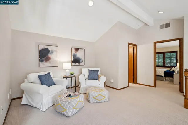 a bathroom with a granite countertop sink mirror and a bathtub