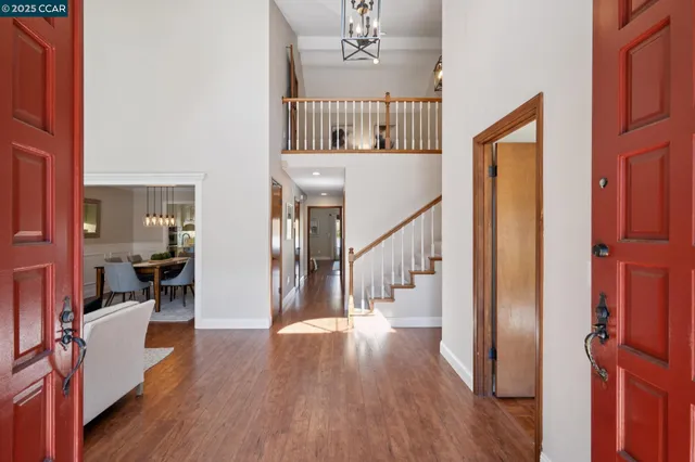 a living room with fireplace furniture and a window