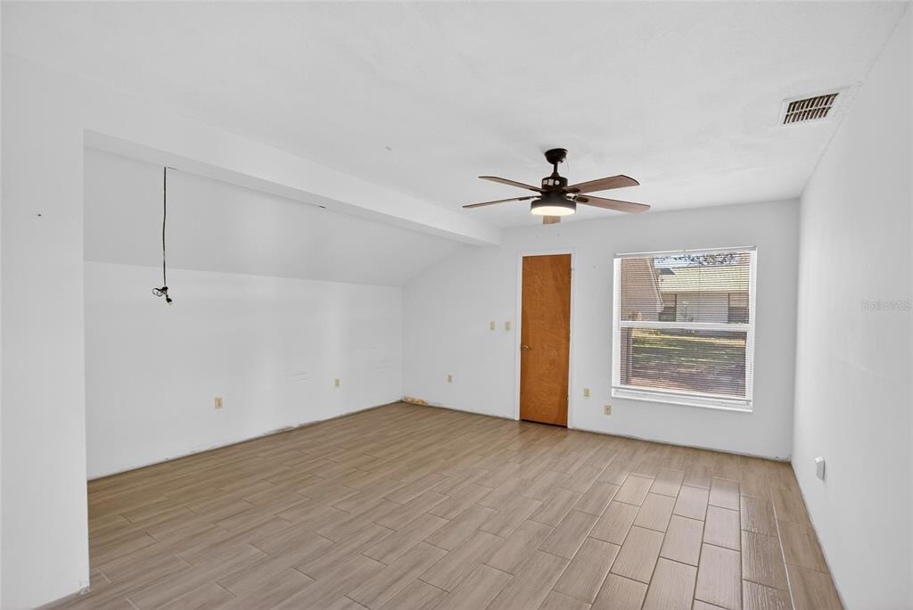 15047 Woodbury Road Brooksville, FL 34604 - Photo 27 of 98 a view of an empty room with a window