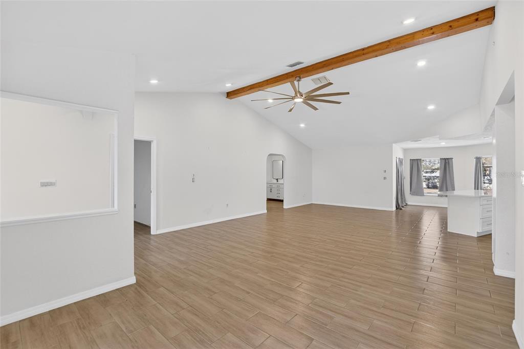 15047 Woodbury Road Brooksville, FL 34604 - Photo 32 of 98 a view of empty room with wooden floor
