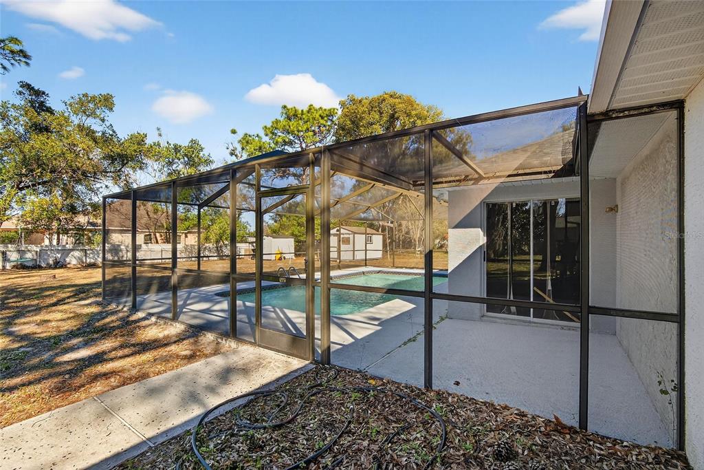 15047 Woodbury Road Brooksville, FL 34604 - Photo 51 of 98 a view of a house with a porch