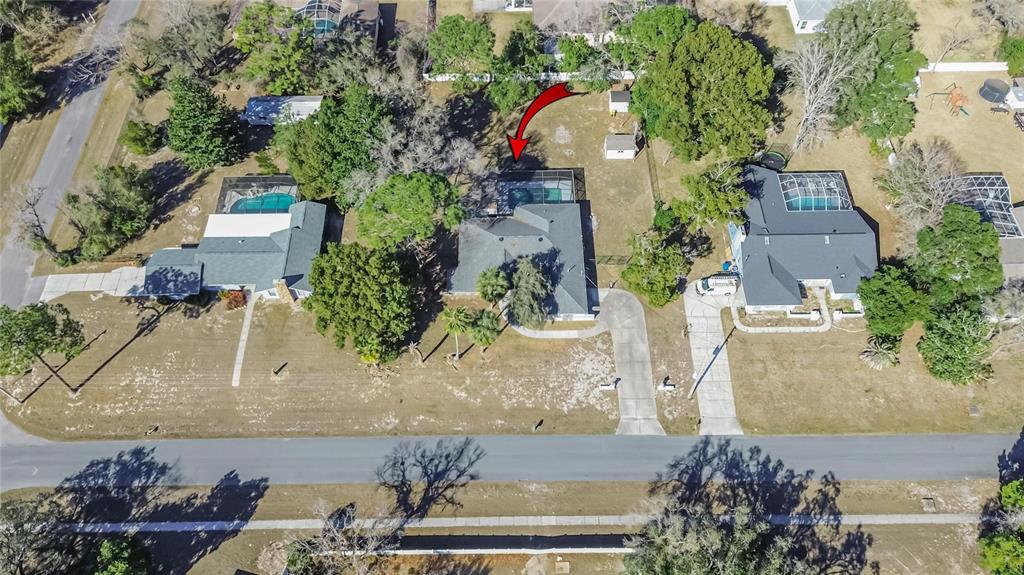 15047 Woodbury Road Brooksville, FL 34604 - Photo 79 of 98 an aerial view of a house with a yard