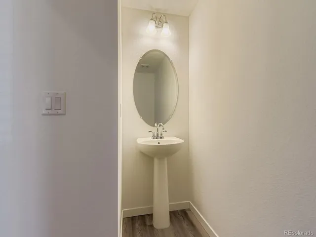 a bathroom with a sink and mirror