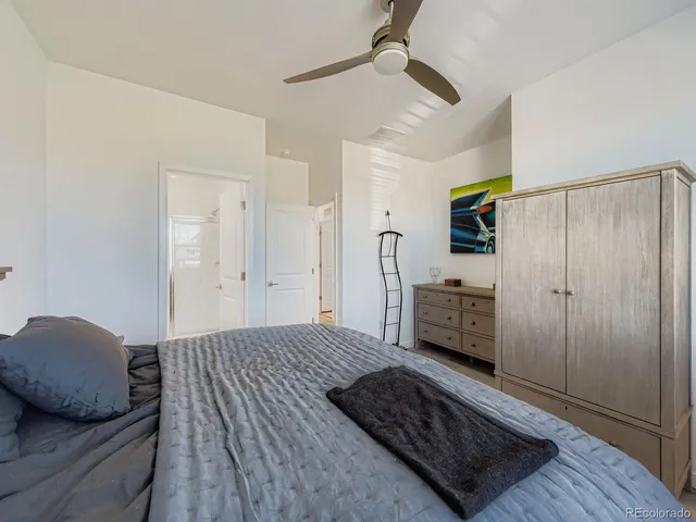 a bedroom with a bed and a walk in closet