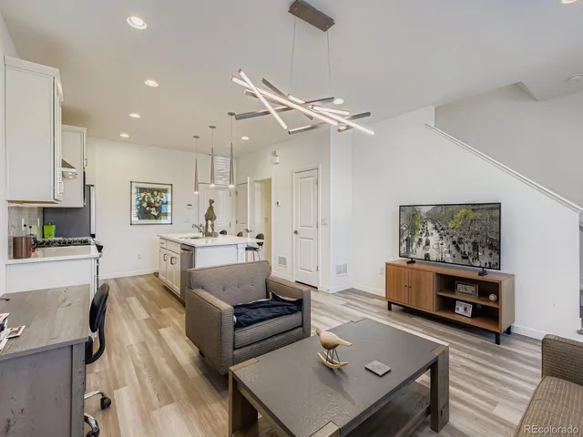 a living room with furniture and a table
