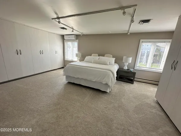 a view of a livingroom with furniture and an entrance