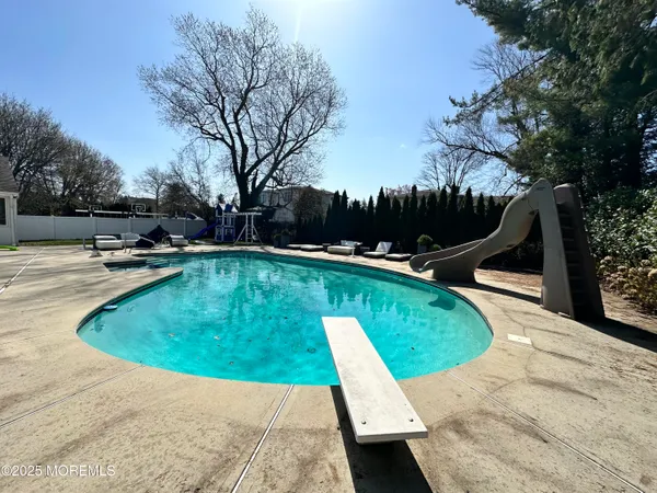 a view of a park with large trees
