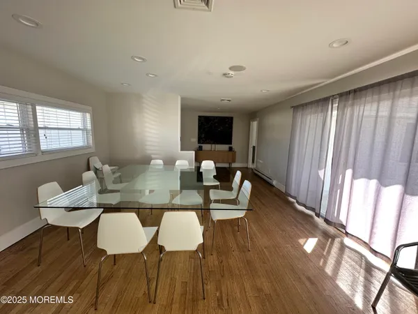 a spacious bedroom with a bed and a window