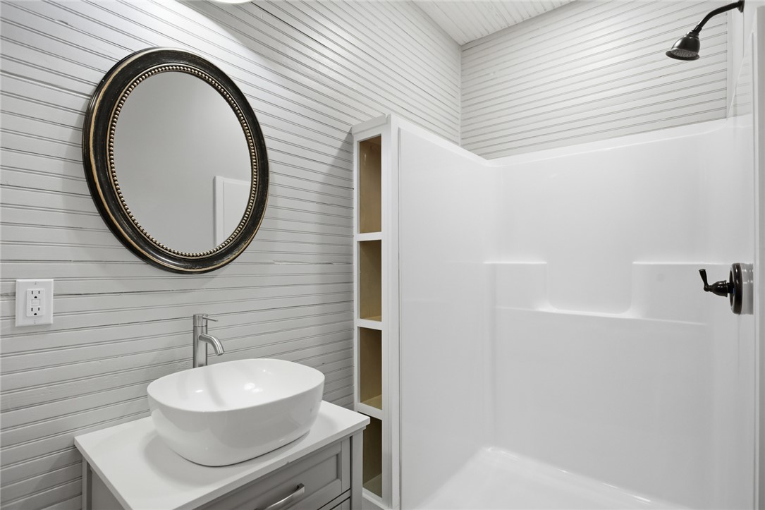 118 Grogan Road Westminster, SC 29693 - Photo 26 of 50 Beadboard walls and a vessel sink vanity lend timeless character to this updated bathroom.