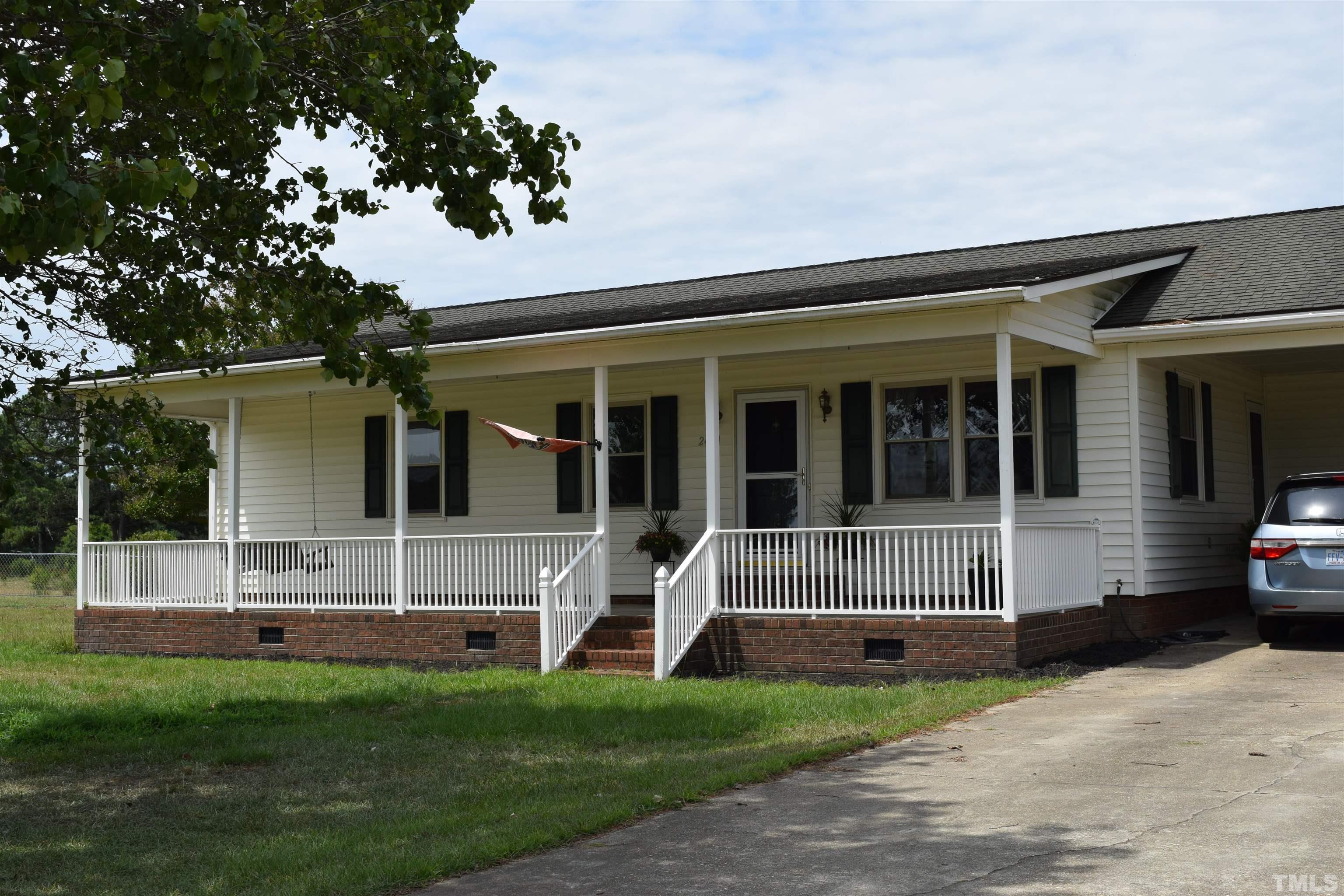 2451 Baileys Crossroads Road Coats, NC 27521 - Photo 2 of 13 a view of a house with backyard