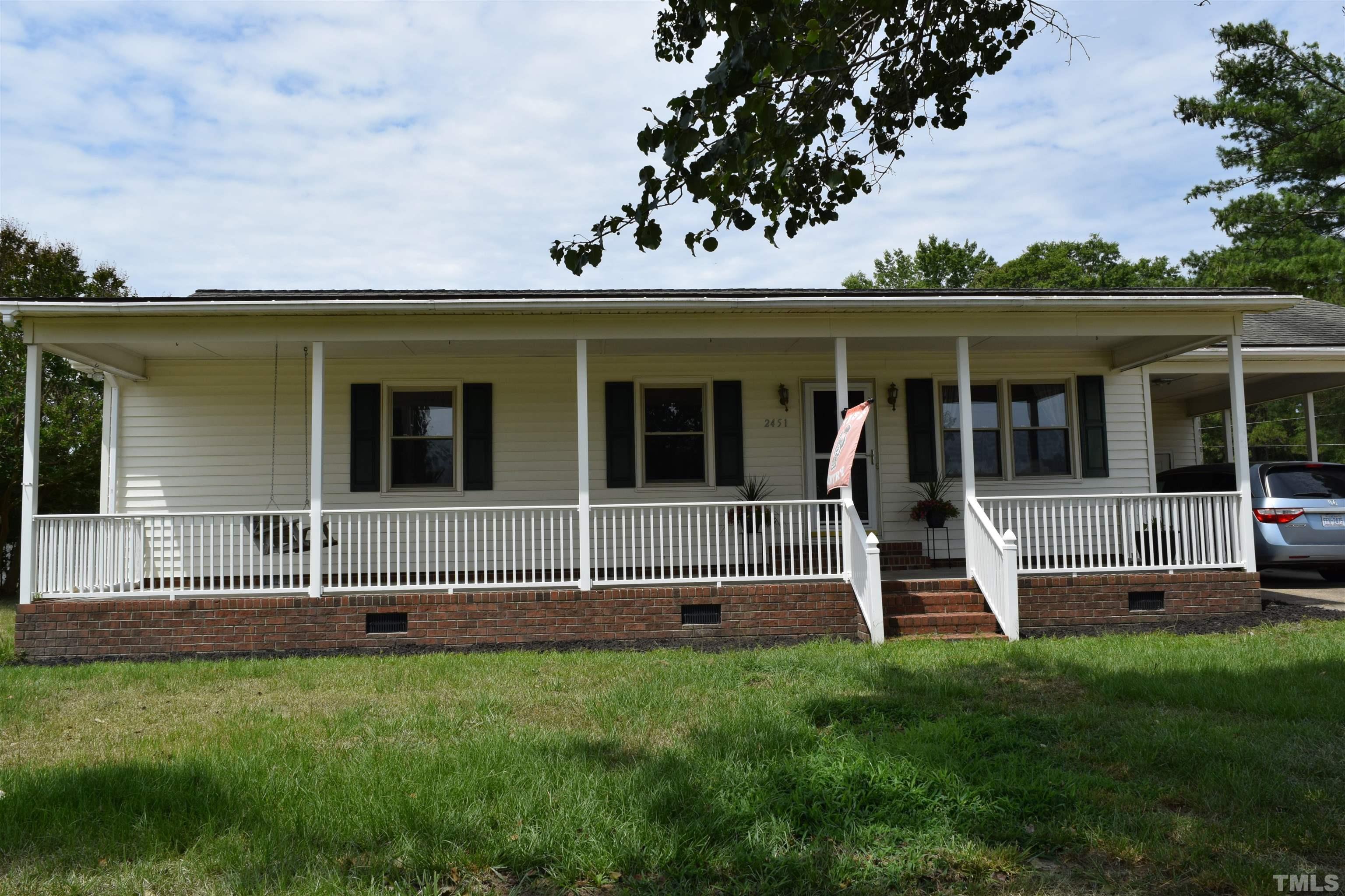 2451 Baileys Crossroads Road Coats, NC 27521 - Photo 8 of 13 front view of a house with a yard