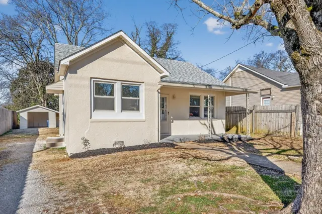 a front view of a house with a patio