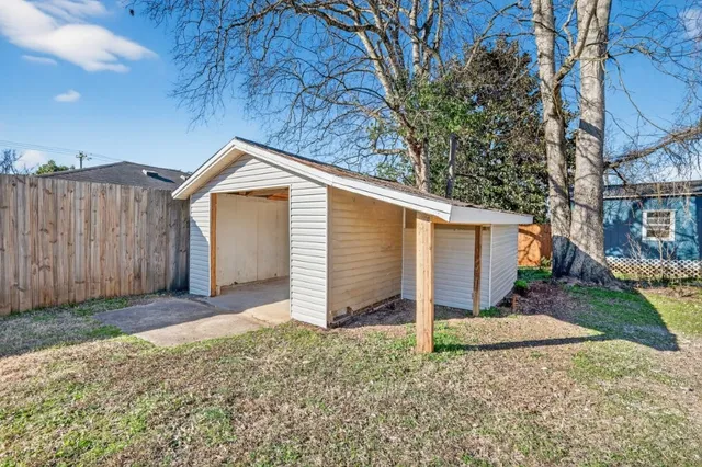 a view of a house with a yard and garage