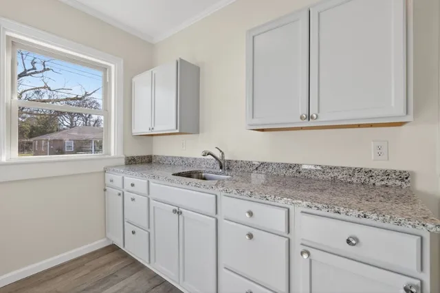 a kitchen with appliances cabinets and a window