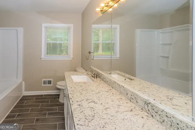 a bathroom with a sink and a bathtub