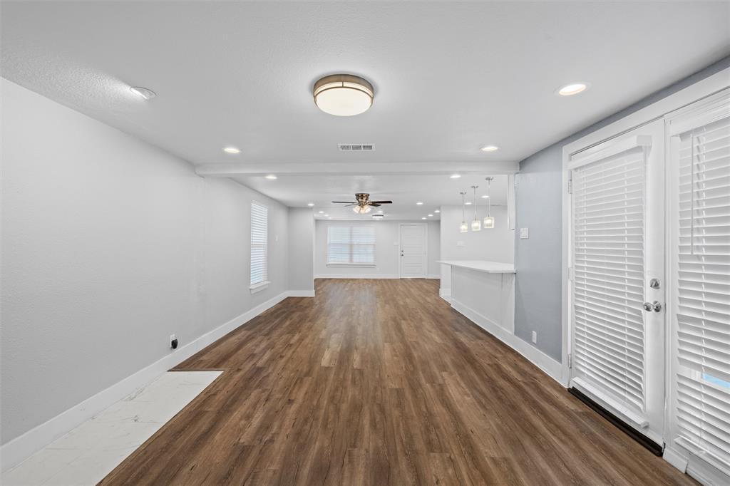 3514 Larry Street Rowlett, TX 75088 - Photo 10 of 27 wooden floor in an empty room with a window