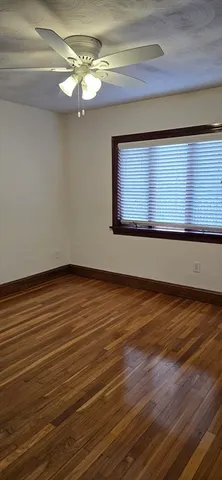 a view of room with wooden floor