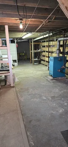 a view of empty room with wooden ceiling
