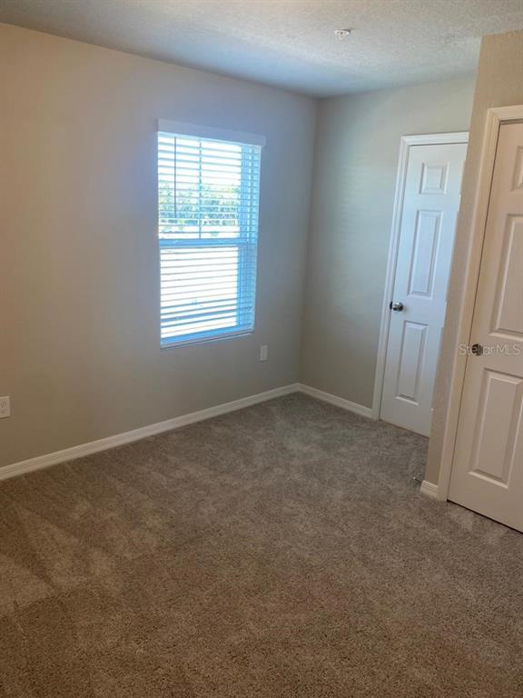 2053 Milkweed Street Ocoee, FL 34761 - Photo 13 of 17 an empty room with a window