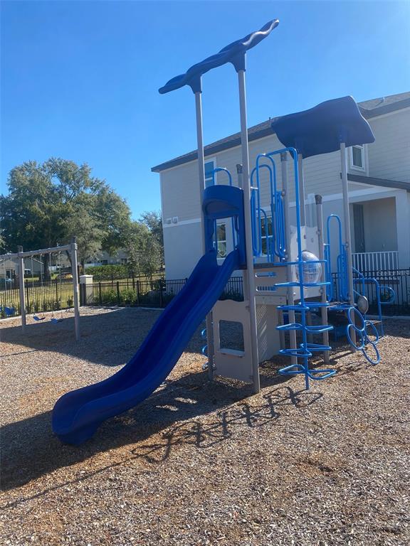 2053 Milkweed Street Ocoee, FL 34761 - Photo 16 of 17 a view of a house with a yard