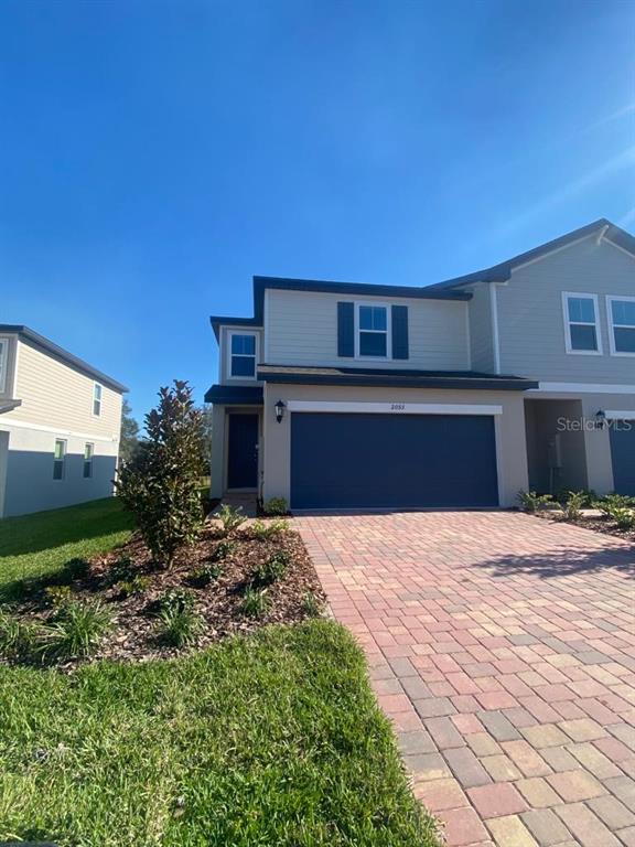 2053 Milkweed Street Ocoee, FL 34761 - Photo 2 of 17 a house view with a garden space