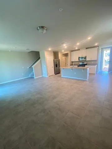 a view of a kitchen and a window