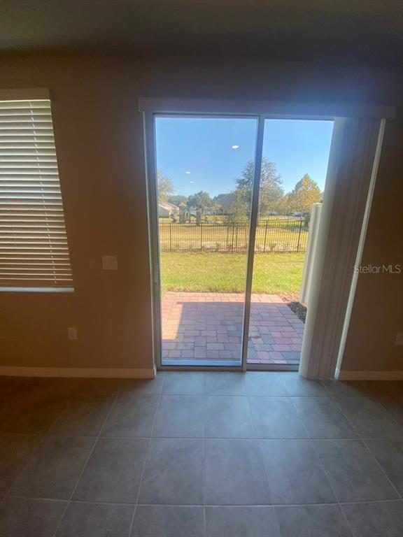 2053 Milkweed Street Ocoee, FL 34761 - Photo 7 of 17 a view of an empty room and window