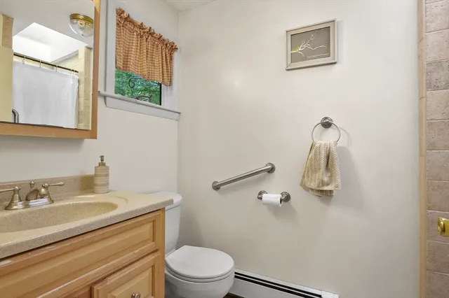 a view of a patio with couches table and chairs with wooden floor and fence