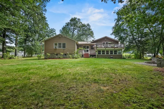 a view of a backyard with a garden and trees