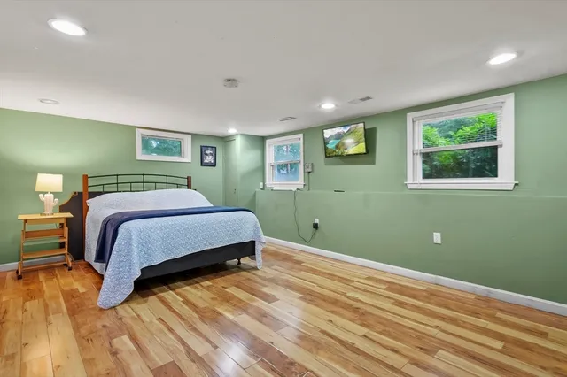 a spacious bedroom with a bed and furniture