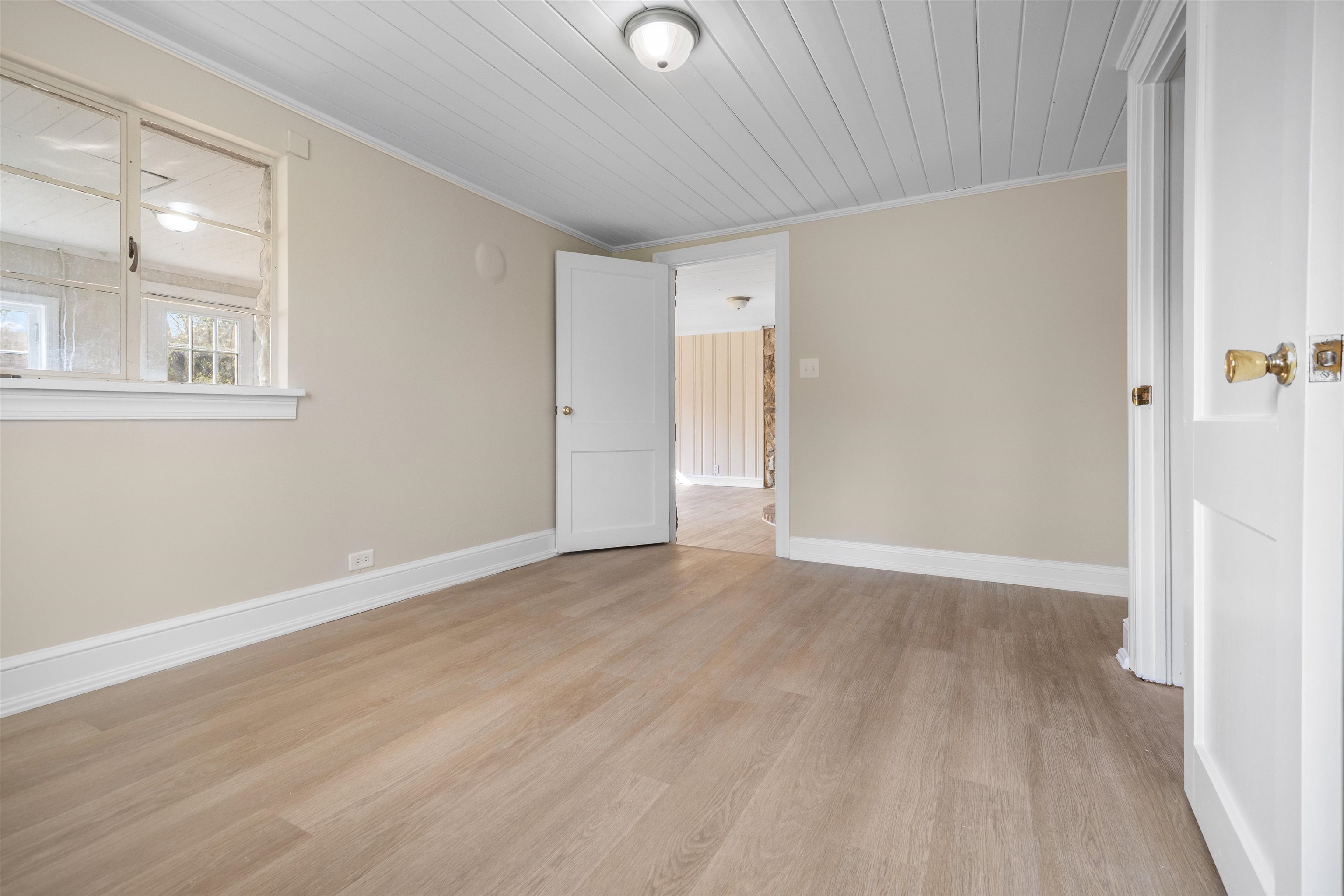 1641 Smithland Road Harrisonburg, VA 22802 - Photo 11 of 44 a view of an empty room with wooden floor and a window