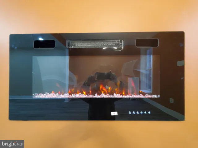 a kitchen with a refrigerator and a stove