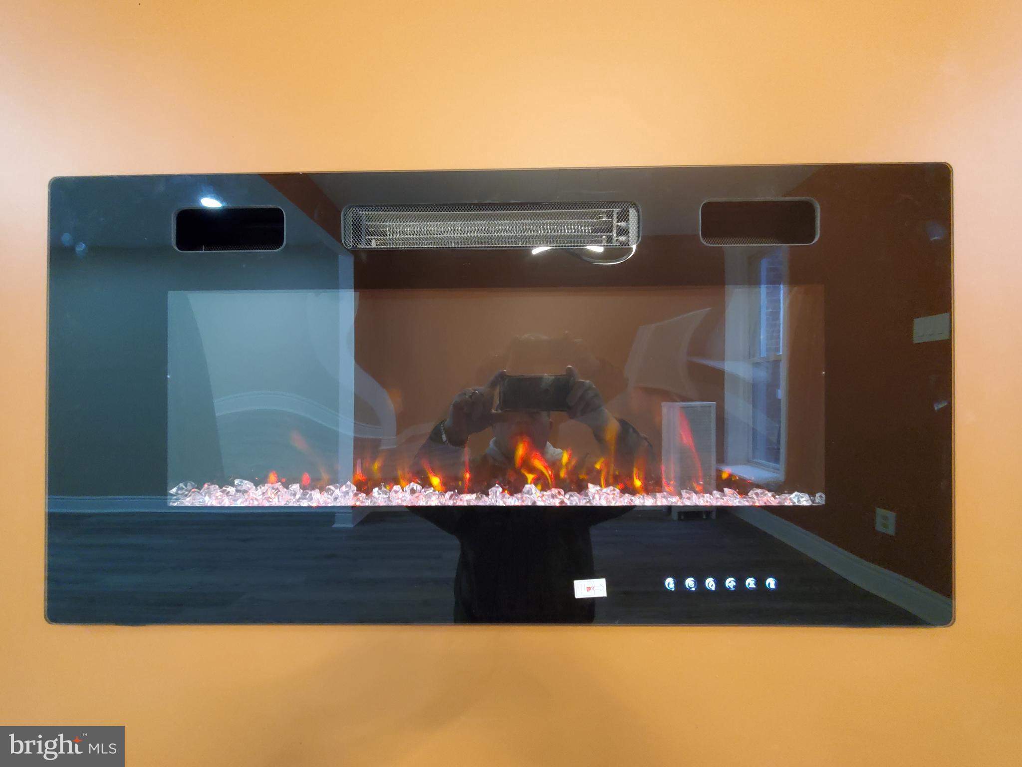 245 Widener Street Philadelphia, PA 19120 - Photo 17 of 44 Electric fireplace in dining room