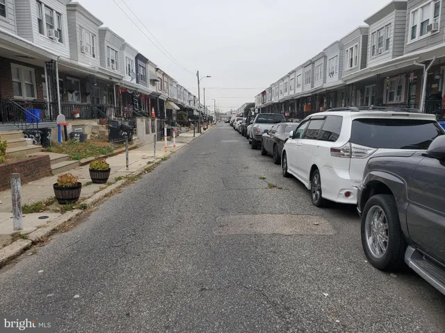 a view of a street with cars