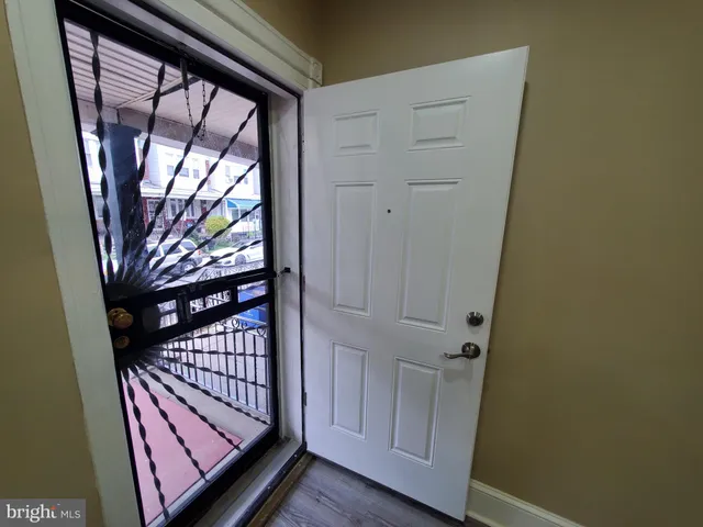 a view of a room with wooden floor and staircase