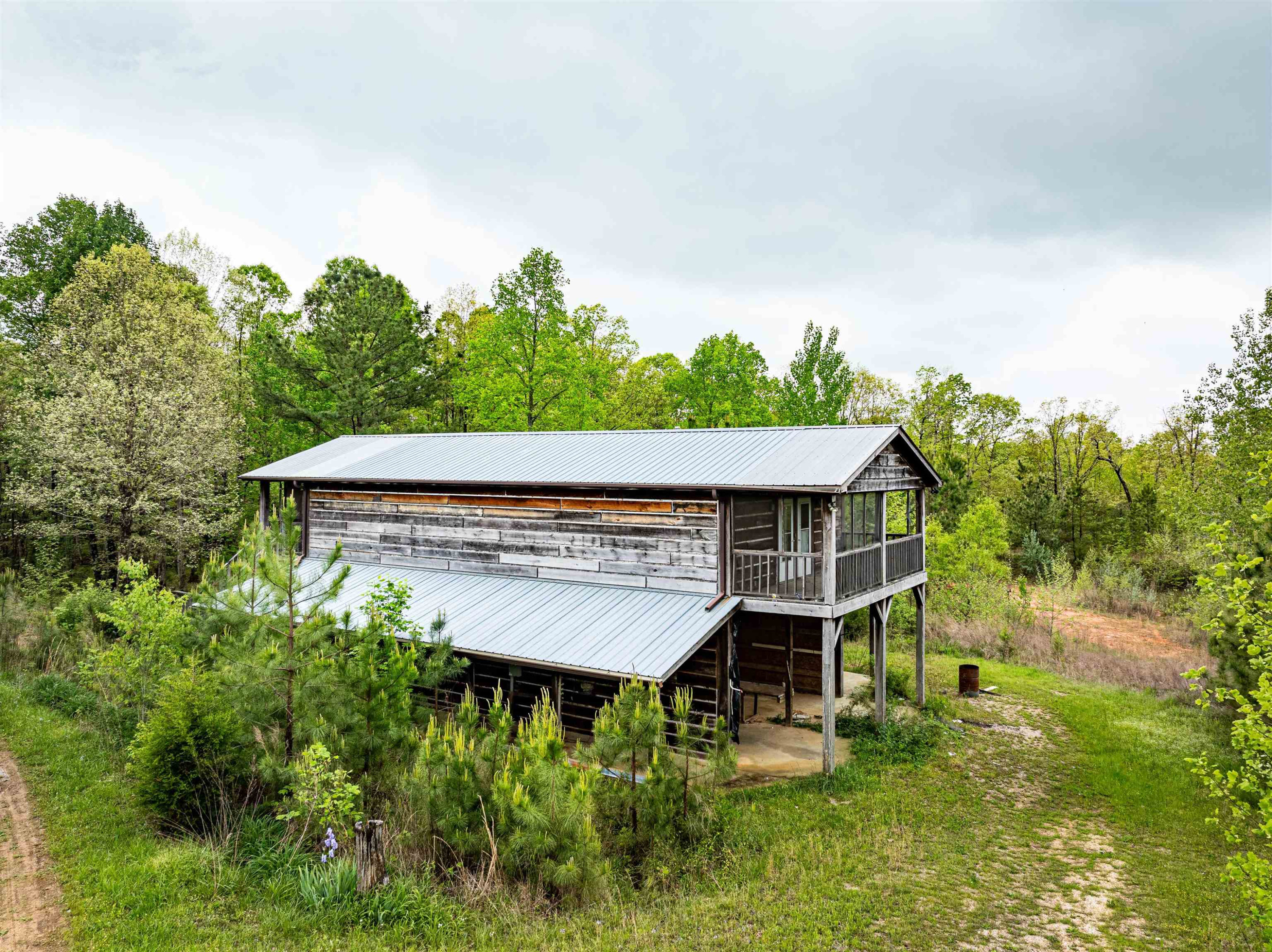 800 Bob's Landing Road Bath Springs, TN 38311 - Photo 15 of 48 a view of a wooden deck besides a house