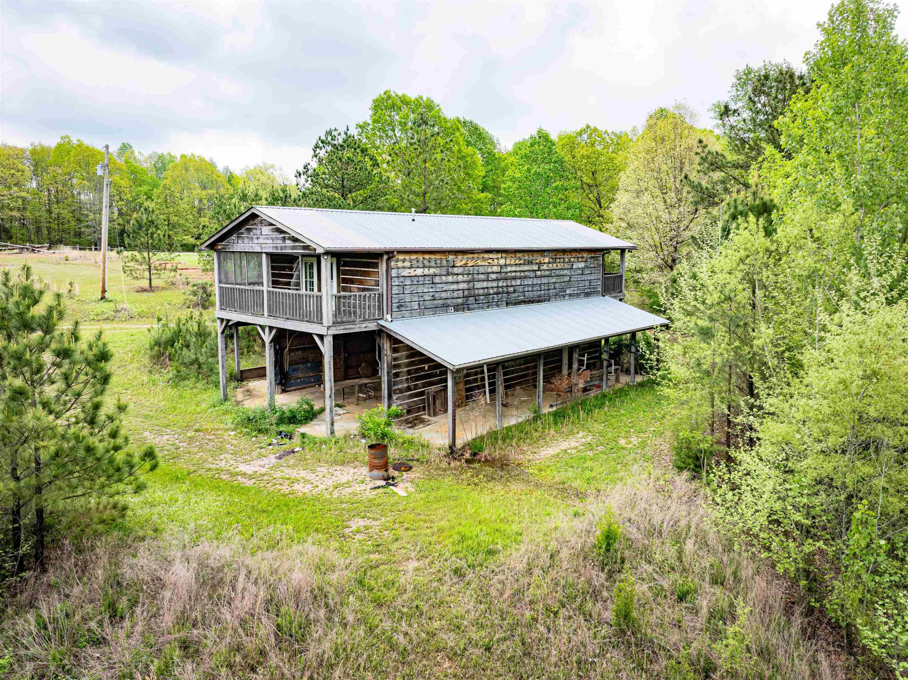 800 Bob's Landing Road Bath Springs, TN 38311 - Photo 19 of 48 a view of a big house with a big yard and large trees