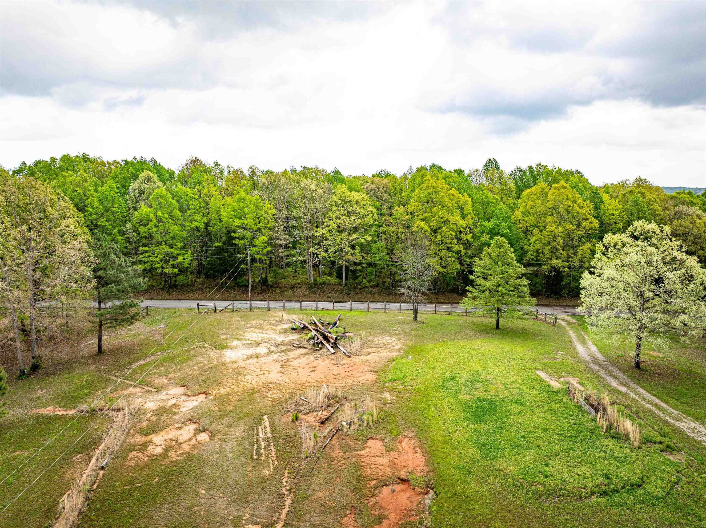 800 Bob's Landing Road Bath Springs, TN 38311 - Photo 20 of 48 a view of a swimming pool with a yard and large trees