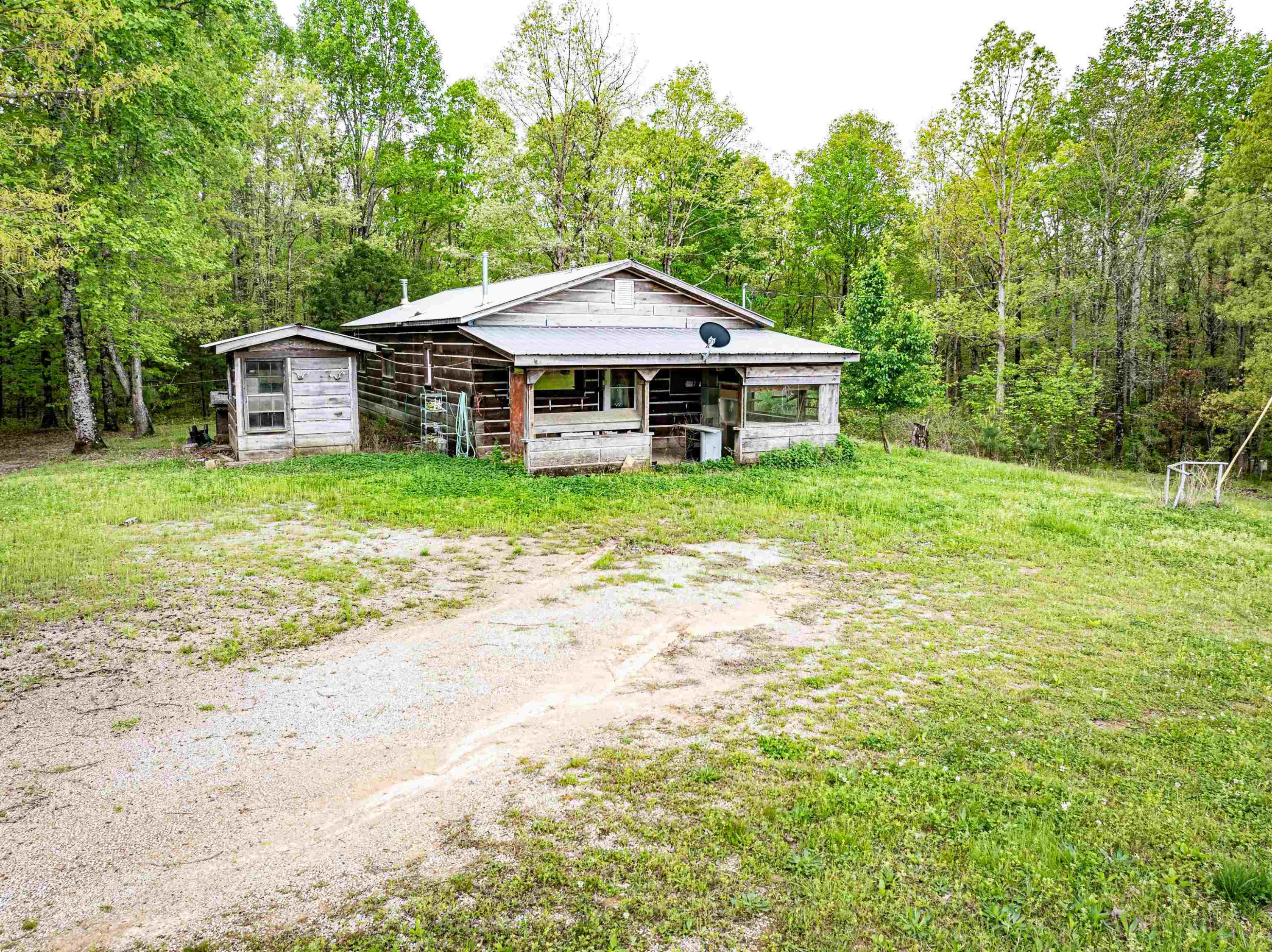 800 Bob's Landing Road Bath Springs, TN 38311 - Photo 23 of 48 a big house with a big yard and large trees
