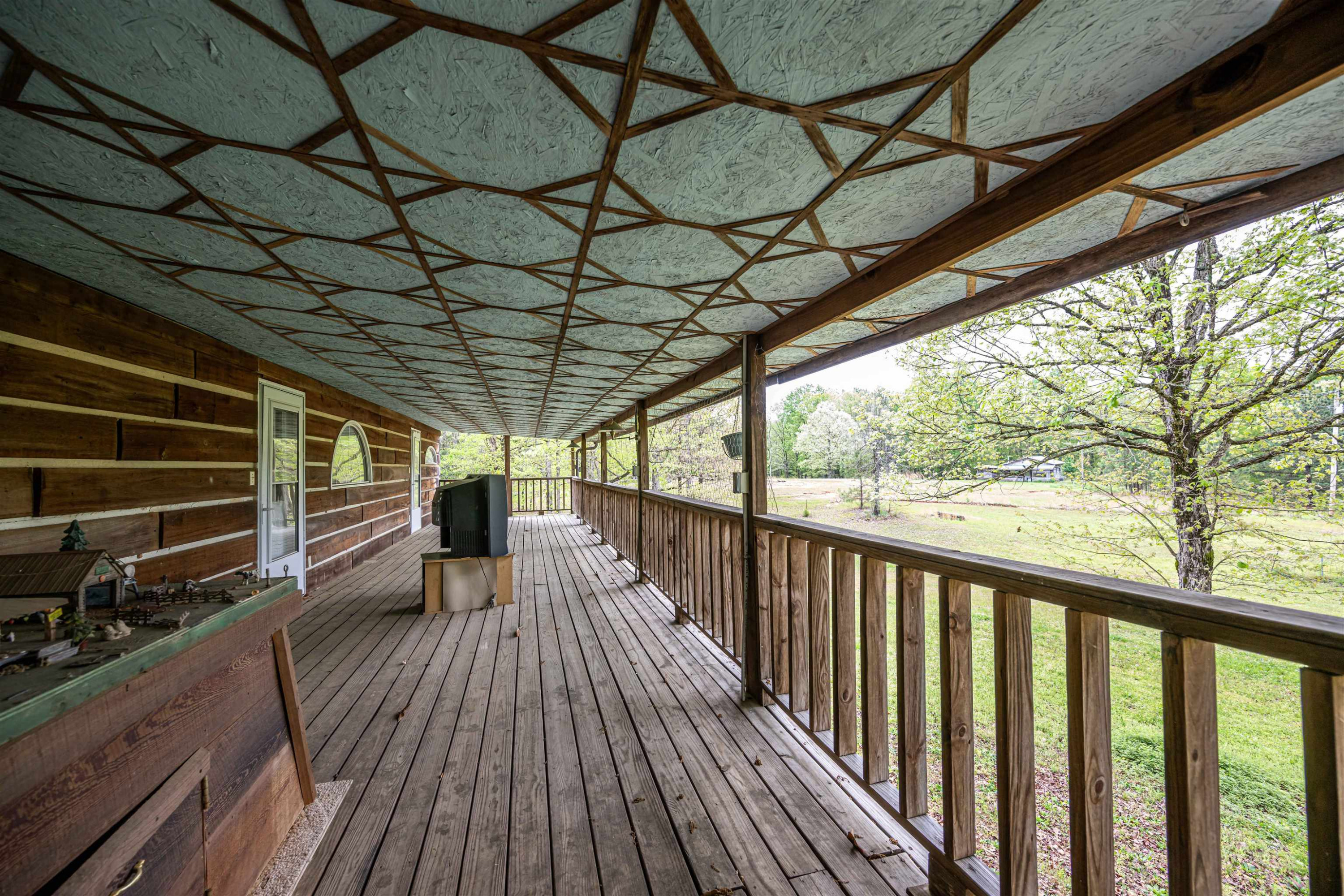 800 Bob's Landing Road Bath Springs, TN 38311 - Photo 31 of 48 a view of balcony with wooden floor and outdoor seating