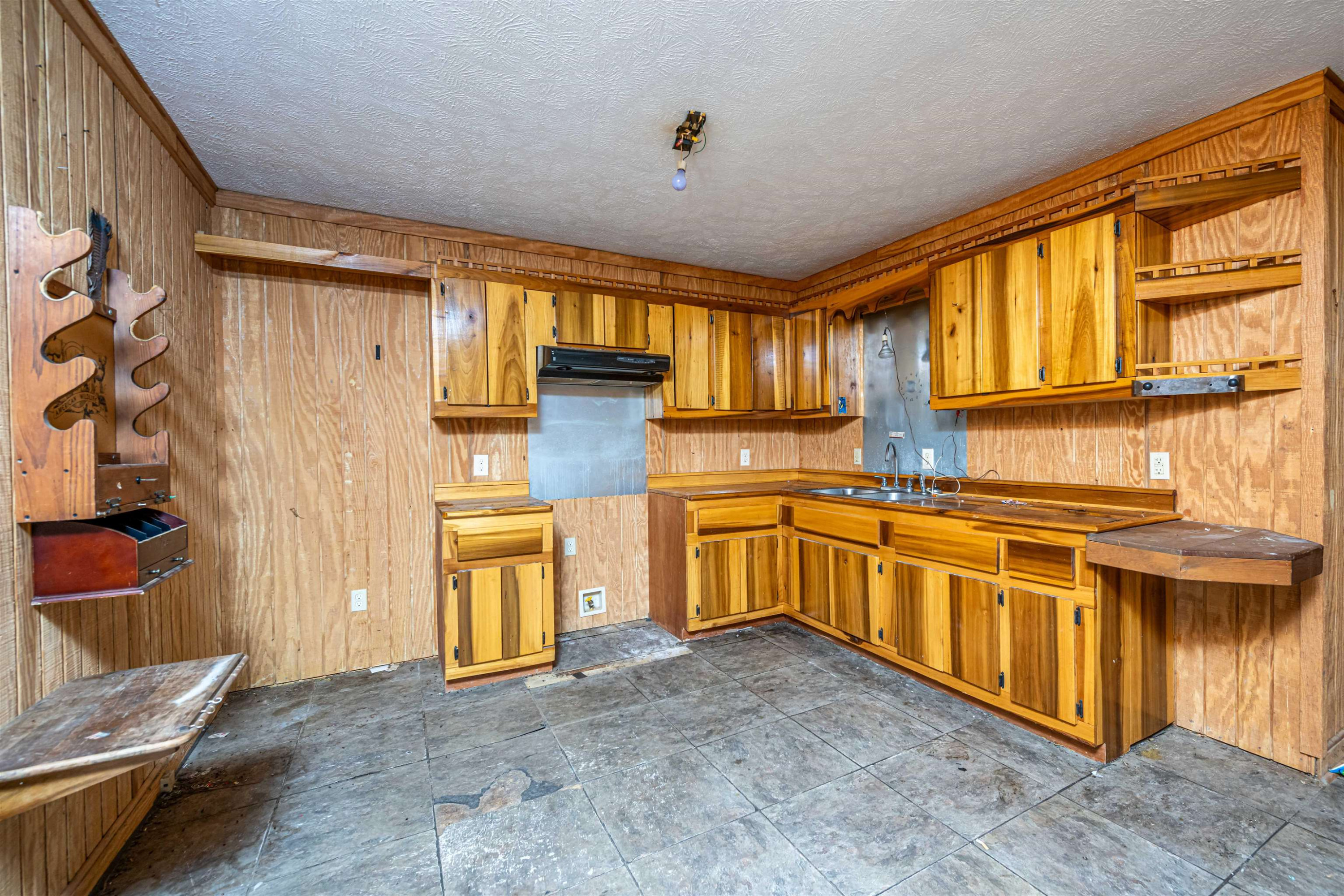 800 Bob's Landing Road Bath Springs, TN 38311 - Photo 32 of 48 a kitchen with stainless steel appliances granite countertop a stove and a refrigerator