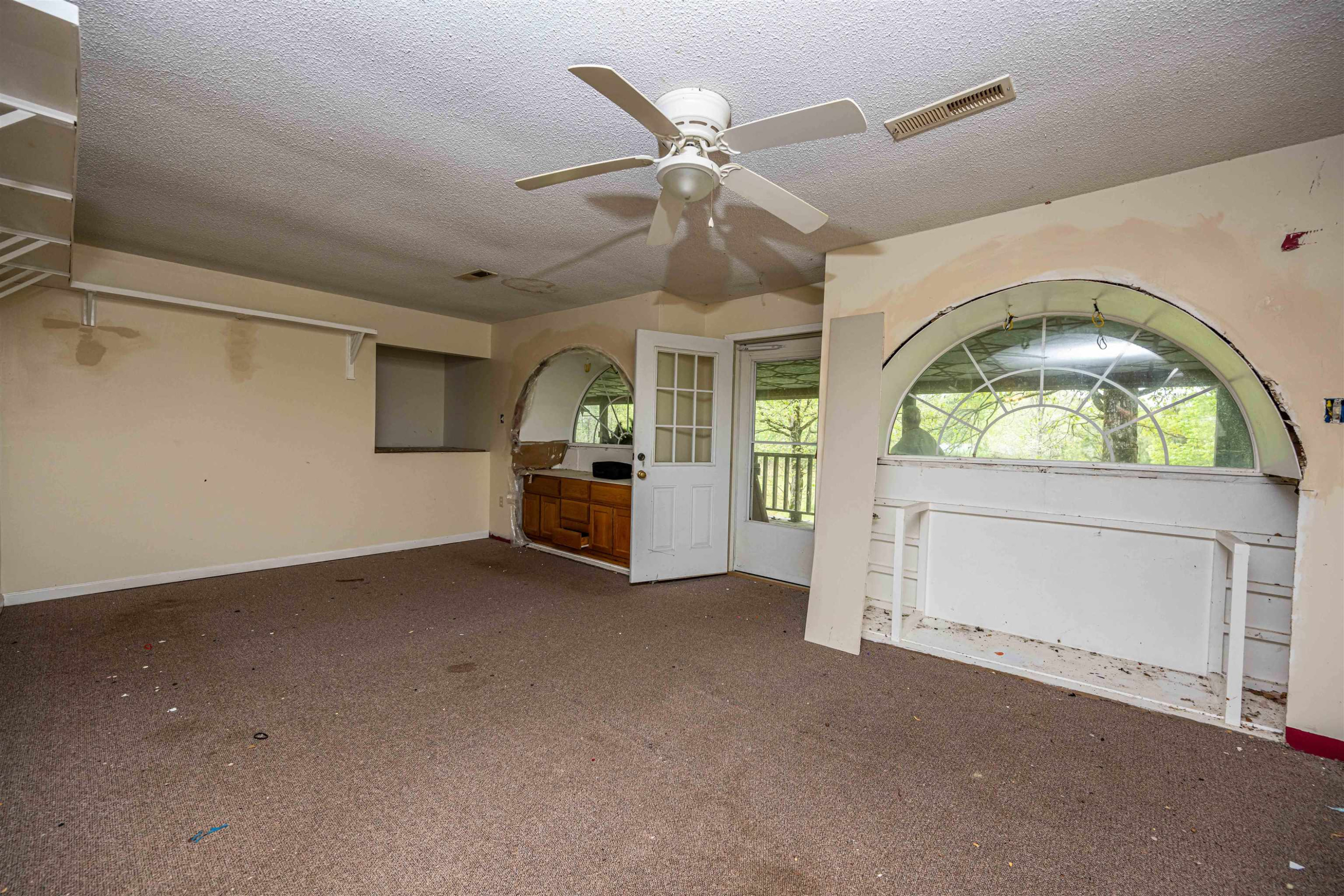800 Bob's Landing Road Bath Springs, TN 38311 - Photo 39 of 48 a view of an empty room with a fireplace and a window