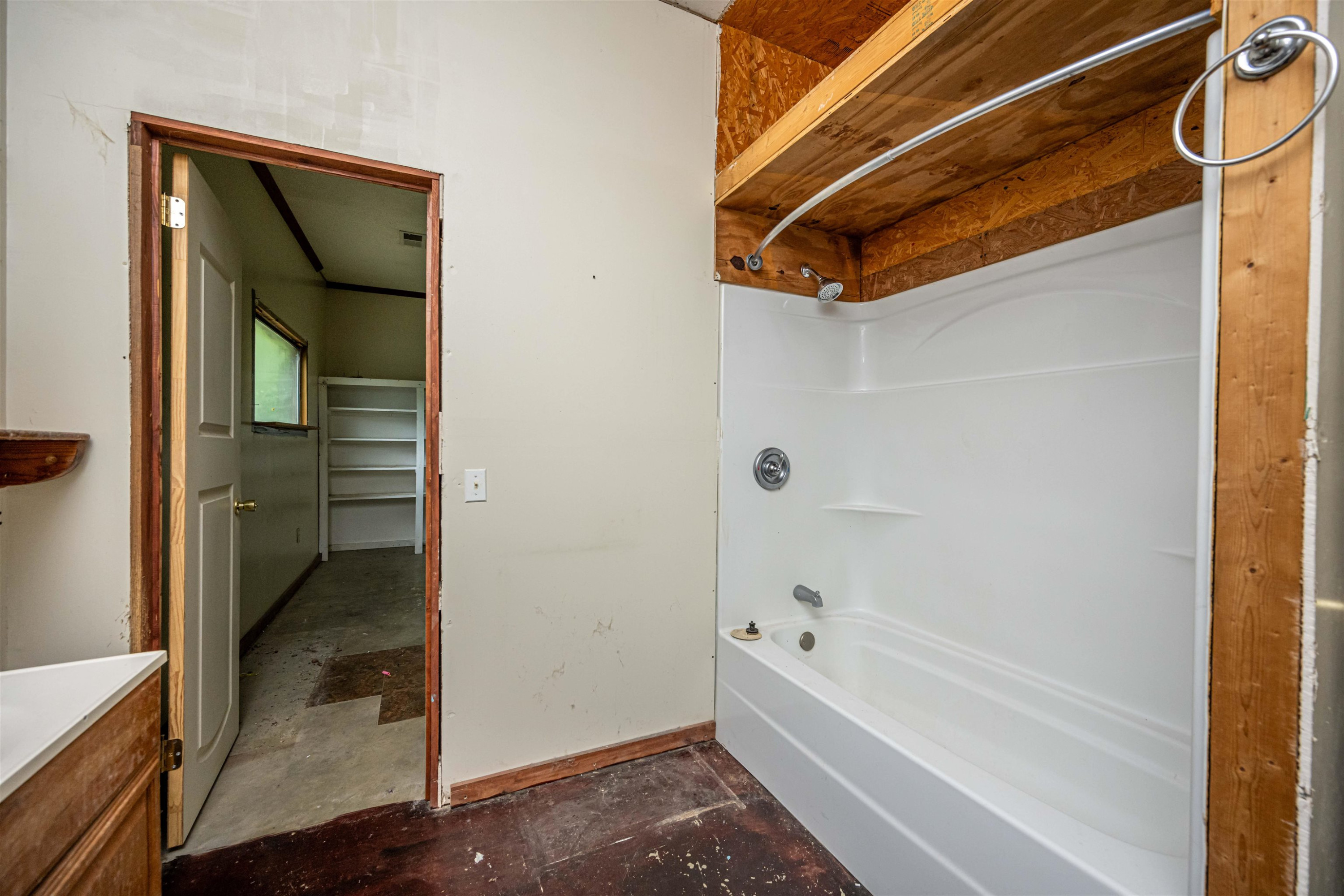 800 Bob's Landing Road Bath Springs, TN 38311 - Photo 48 of 48 a bathroom with a tub and shower