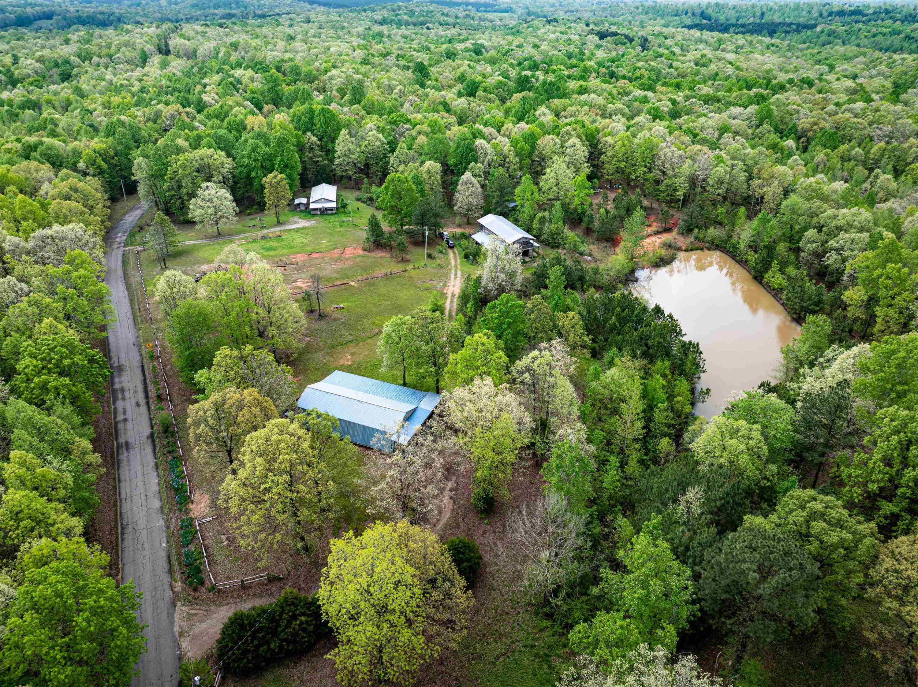 800 Bob's Landing Road Bath Springs, TN 38311 - Photo 5 of 48 an aerial view of residential house with outdoor space and trees all around
